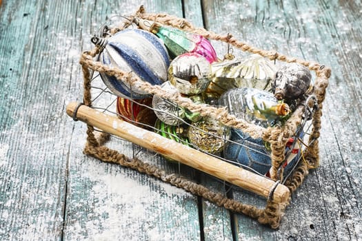 Woven wire basket with vintage Christmas glass ornaments