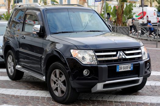 San Remo, Italy - October 16, 2016: Black Mitsubishi Pajero SUV Badly Parked in the Street of San Remo, Italia