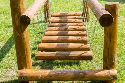 the childrens bridge made of logs and chains