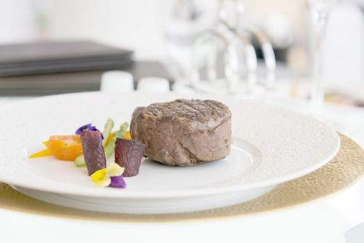 minimalistic dish steak with vegetables on a white plate