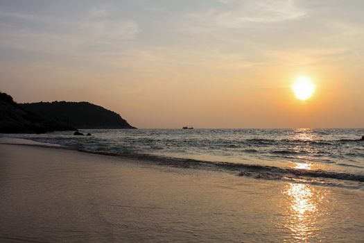 a silhouette rocks at sunset on seashore. Sunset landscape of sea, southern Thailand, Phuket Island