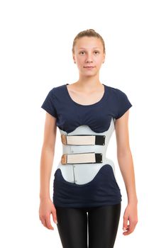 teenage patient in a corset Chenault isolated on white background. Treatment scoliosis. 