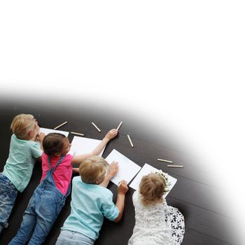 Group of cute children drawing with colorful pencils on floor