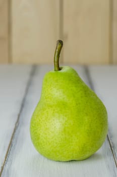 Fresh pears on the wooden background. Still life