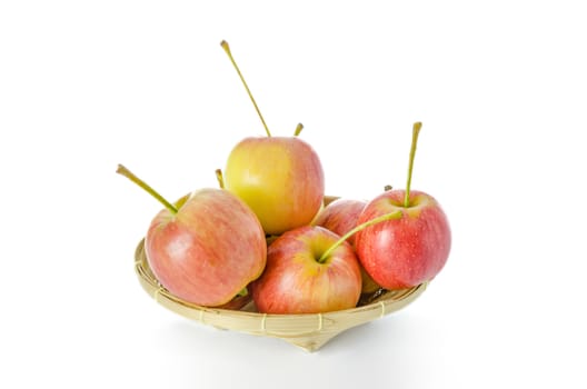 Red and yellow apple  with bamboo basket , organic fresh fruit.