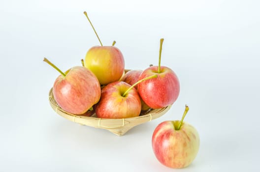 Red and yellow apple  with bamboo basket , organic fresh fruit.
