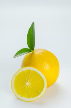 ripe orange with leaves on white background