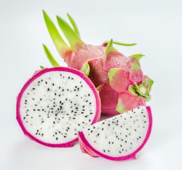 Ripe Dragon fruit or Pitaya with slice on white background