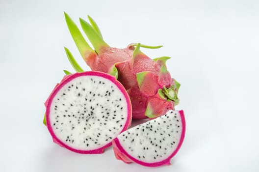 Ripe Dragon fruit or Pitaya with slice on white background
