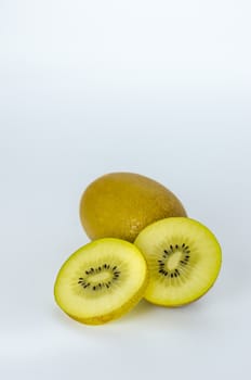 delicious whole kiwi fruit and half on white background