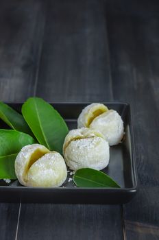 Daifuku Mochi Japanese dessert on dish over wooden background