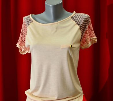 picture of a fashion summer clothes on a manequin doll on a red background