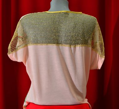 picture of a fashion summer clothes on a manequin doll on a red background