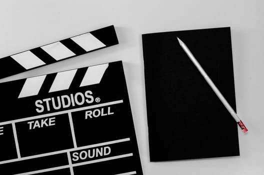 Slate film and black notebook white background