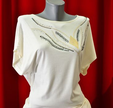 picture of a fashion summer clothes on a manequin doll on a red background