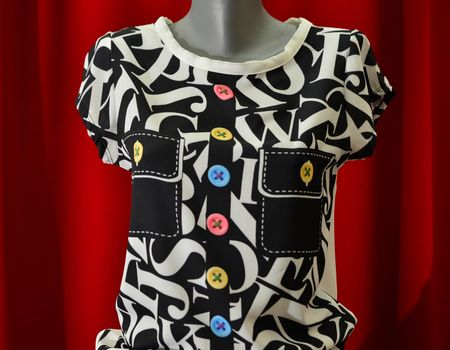 picture of a fashion summer clothes on a manequin doll on a red background