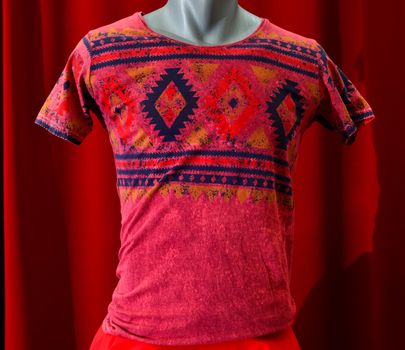 picture of a fashion summer clothes on a manequin doll on a red background