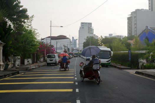 Georgetown, Penang, Malaysia - April 18, 2015: Classic local rickshaw in George Town, Penang in Malaysia