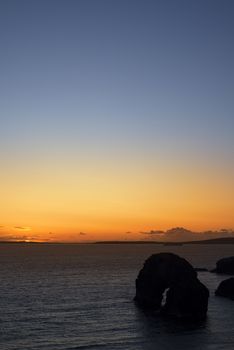 beautiful sunset going down over the virgin rock on the wild atlantic way