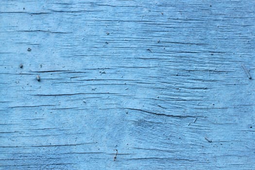 old wooden background with cracked blue paint