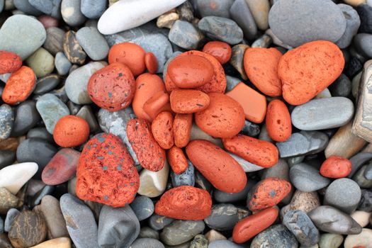 red stones on a pebble beach background