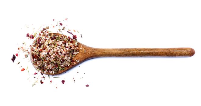 Homemade Herb and Spices Salt with Dried Chili Pepper, Rosemary, Thyme and Coriander in Wooden Spoon isolated on White background