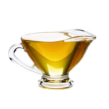 Delicious Fresh Olive Oil in Glass Gravy Boat isolated on White background