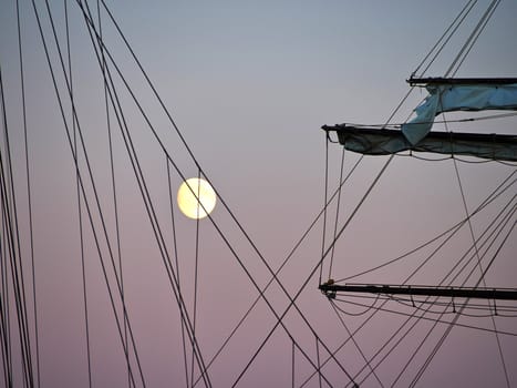 Sailing yacht tall ship illuminated by the light of a full moon great boating sailing background image