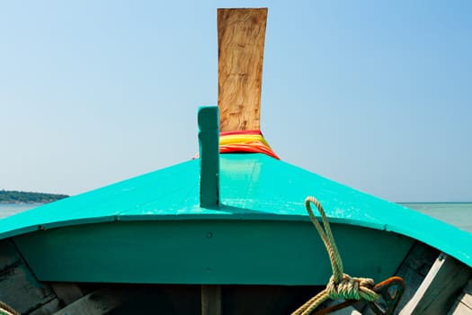 Bow of a Thai boat with colored scarfs