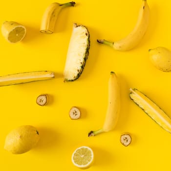 Yellow colored fruit over a yellow background