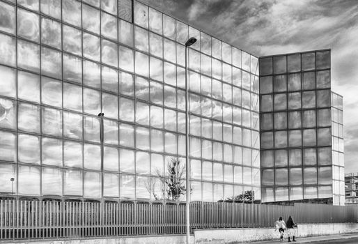 Modern palace at sunset with a cluody sky in the city of Sassari - Sardinia