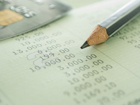 pencil and creditcard on passbook. selective focus.