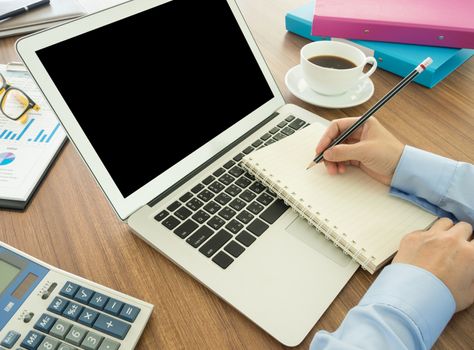 businessman record data on to schedule a meeting or event
