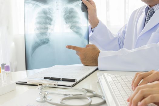 2 doctors working in office of hospital.