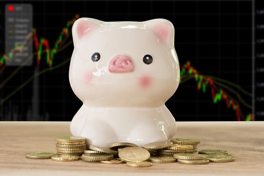 piggybank with golden coins in nature background. account concept,business concept,finance concept.