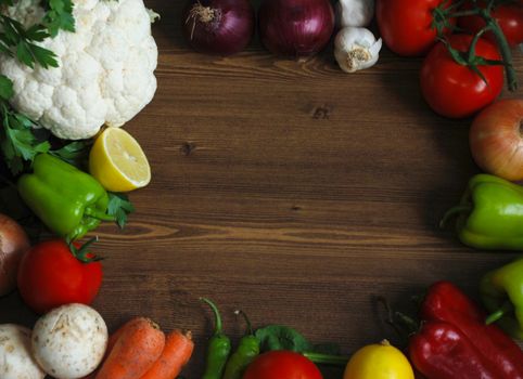 Healthy organic  Assortment of fresh vegetables on dark wooden table.