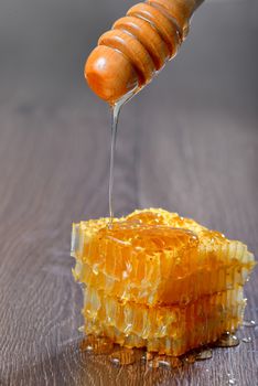 honey runs a honey dipper down isolated