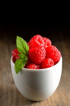 Raspberry fruit isolated on wooden table