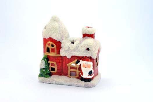 Small house of Christmas in toy with a fir tree and the Santa Claus