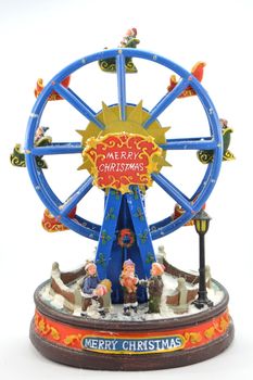 Wooden big wheel of Christmas with a streetlight and characters