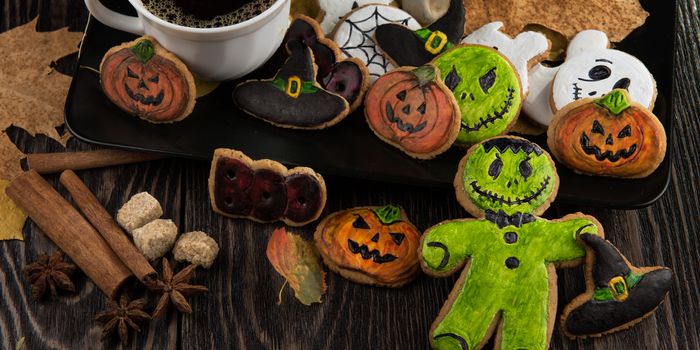 Homemade delicious ginger biscuits for Halloween on wooden table