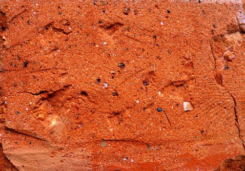 Surface of red brick in close-up as a texture. Macro photo.