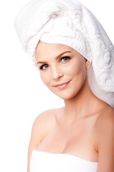 Beautiful clean happy woman with hair wrapped in towels after shower bath, hygiene concept, on white.
