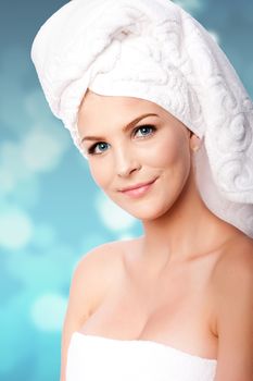 Beautiful clean happy woman with hair wrapped in towels after shower bath, hygiene concept.