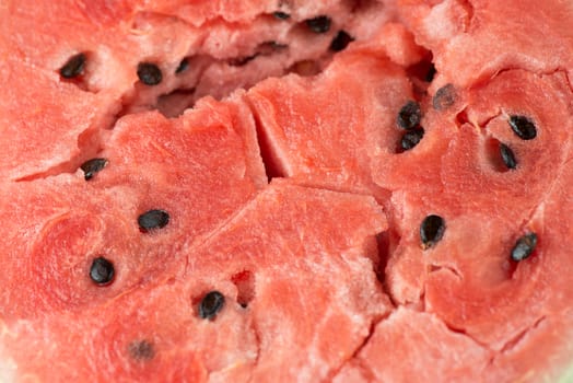 ripe watermelon flesh closeup macro texture background.