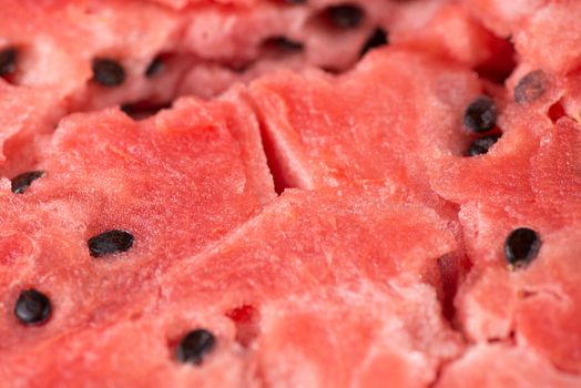 ripe watermelon flesh closeup macro texture background.