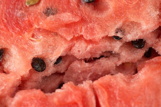 ripe watermelon flesh closeup macro texture background.