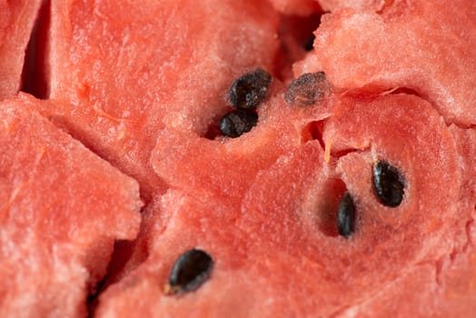 ripe watermelon flesh closeup macro texture background.