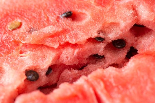 ripe watermelon flesh closeup macro texture background.