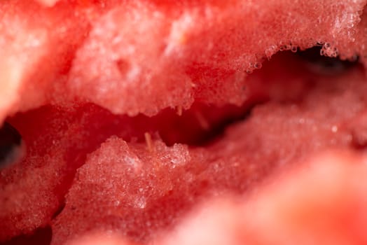 ripe watermelon flesh closeup macro texture background.